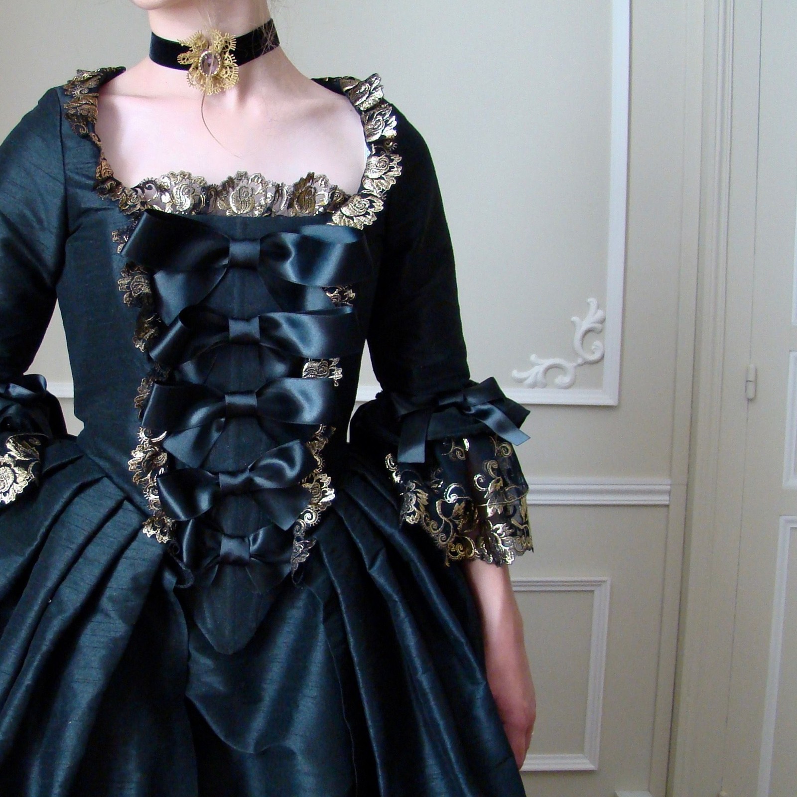 Opulent red fantasy costume with courtly trim and regal styling.